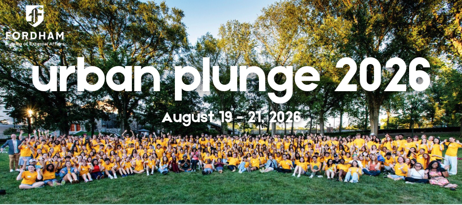 A group of Urban Plunge students sit on a grass lawn and smile together. The text 